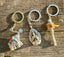 Handmade Tibetan Keychains, High Quality imported from Nepal, Joyful Elephant, Prayer wheel, and Praying Buddha - The Celestial Boutique